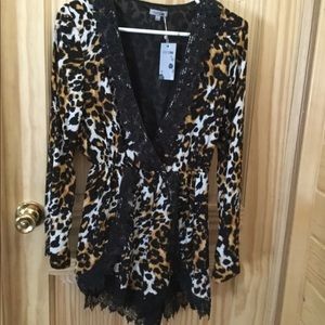 Super cute leopard and lace romper. New with tags